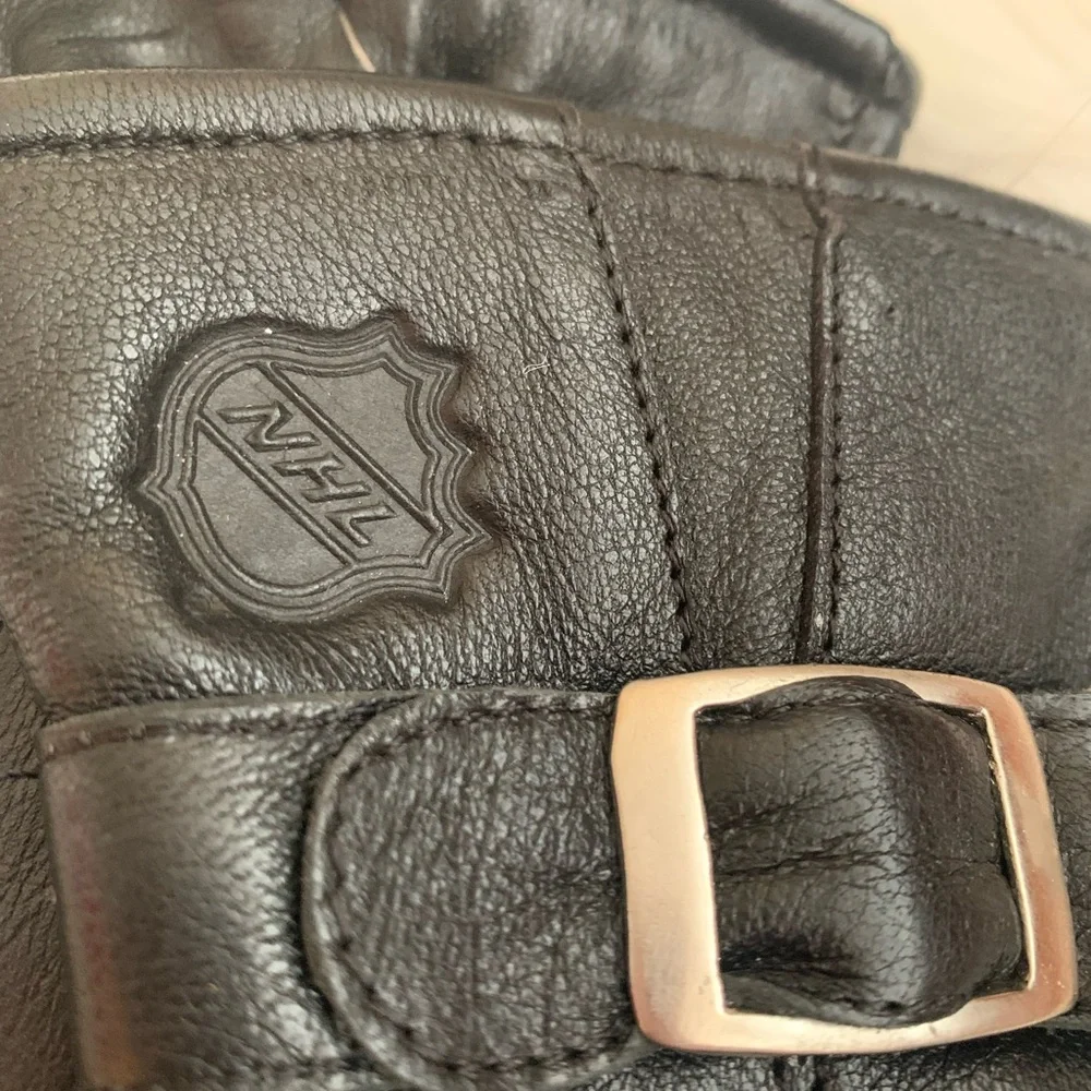 Ladies, black, genuine, leather buckle gloves, size small with NHL Logo NWT